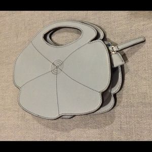 Paige Novick “Wedgewood blue” leather flower clutch